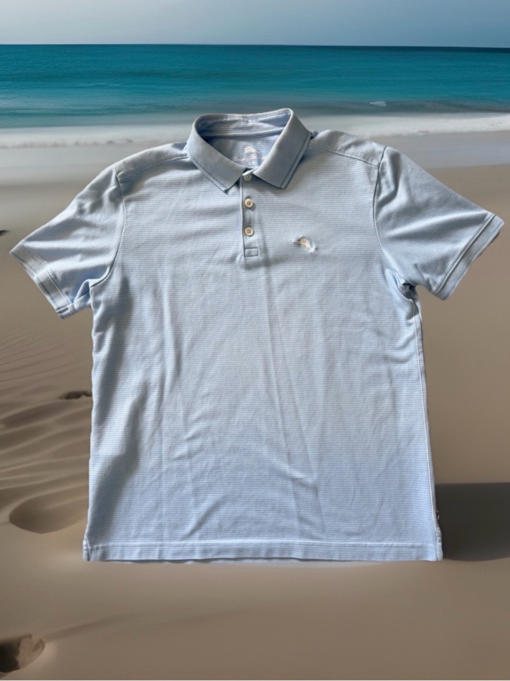 Tommy Bahama men’s size S light blue striped polo shirt. Excellent Condition.